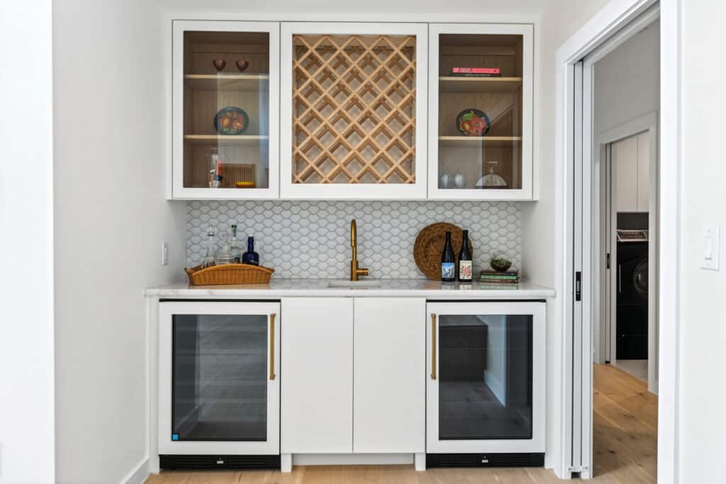 Custom built bar nook with wine racks and storage in a build on your lot home